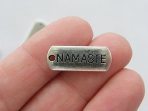 10 Namaste charms antique silver tone M56