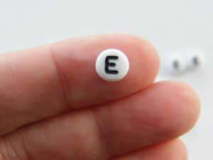 100 Letter E acrylic round alphabet beads white and black