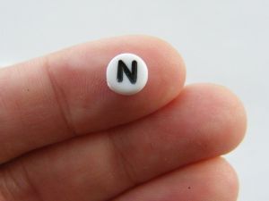 100 Letter N acrylic round alphabet beads white and black