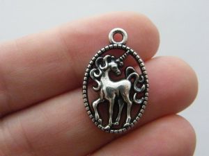 4 Unicorn charms antique silver tone A14
