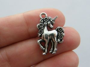 4 Unicorn charms antique silver tone A559